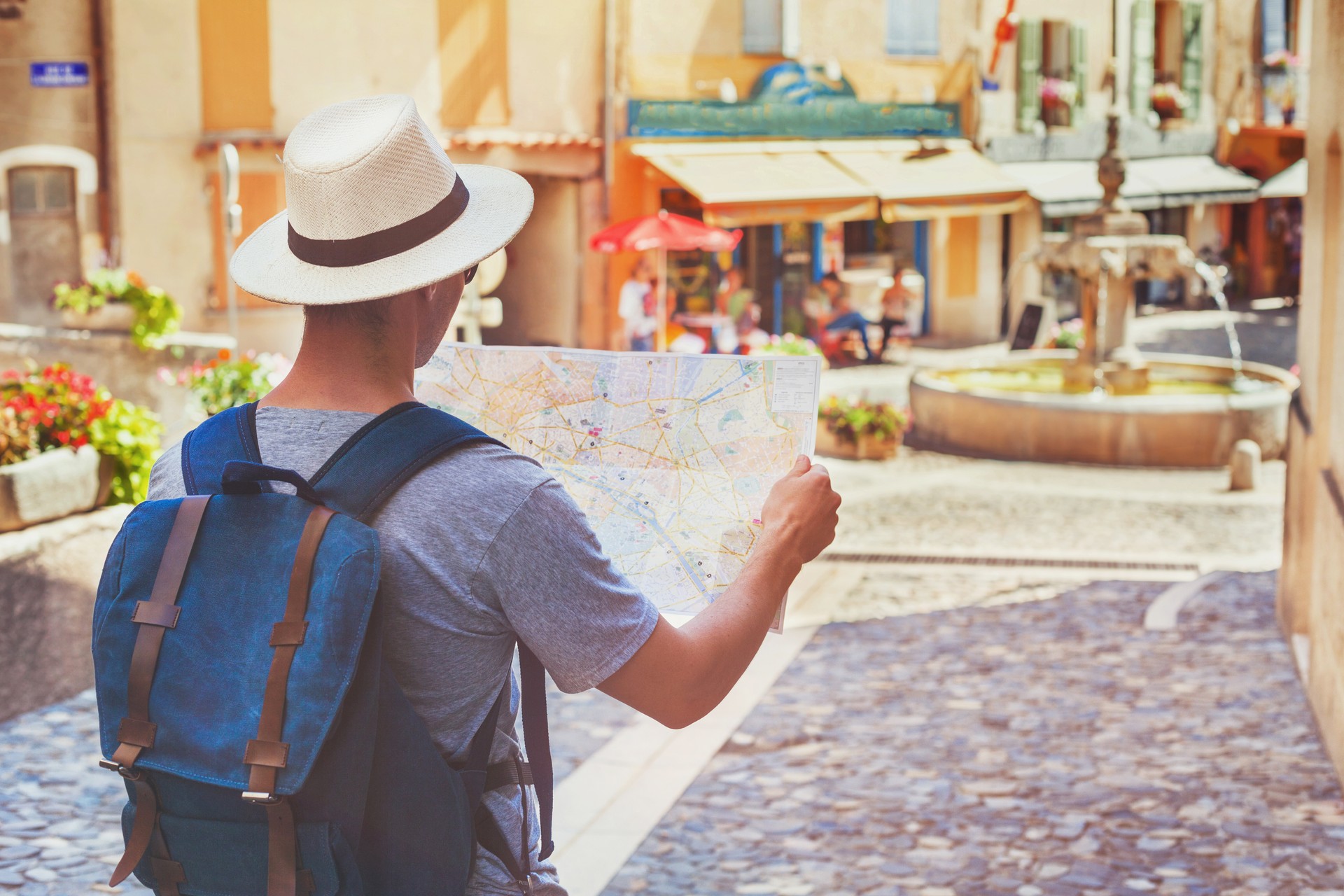 traveling people, tourist looking at map on the street in France, Europe